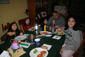 Saturday night's dinner by candlelight: turkey hot dogs, turkey burgers, and veggies.