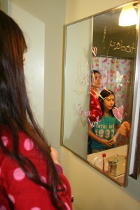 Our bathroom has a mirrored medicine cabinet and a huge mirror, double the fun!