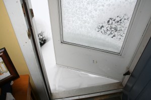 Even under the overhang outside our front door, the snow came right up to the door.