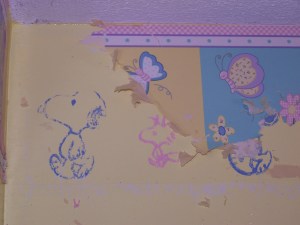 I had forgotten that underneath the "little kid" border was the baby border we'd hand stamped on the walls before Caroline was born.